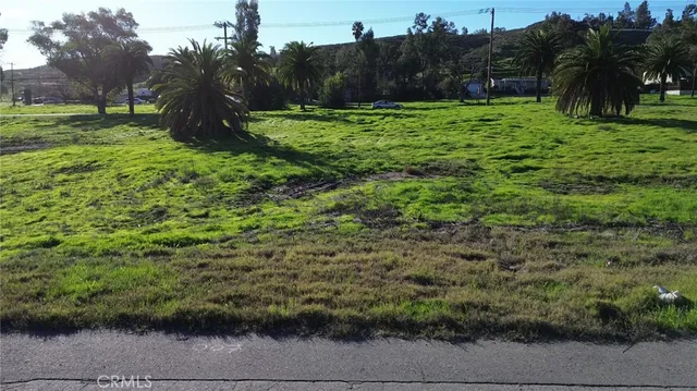 a view of grassy field with trees