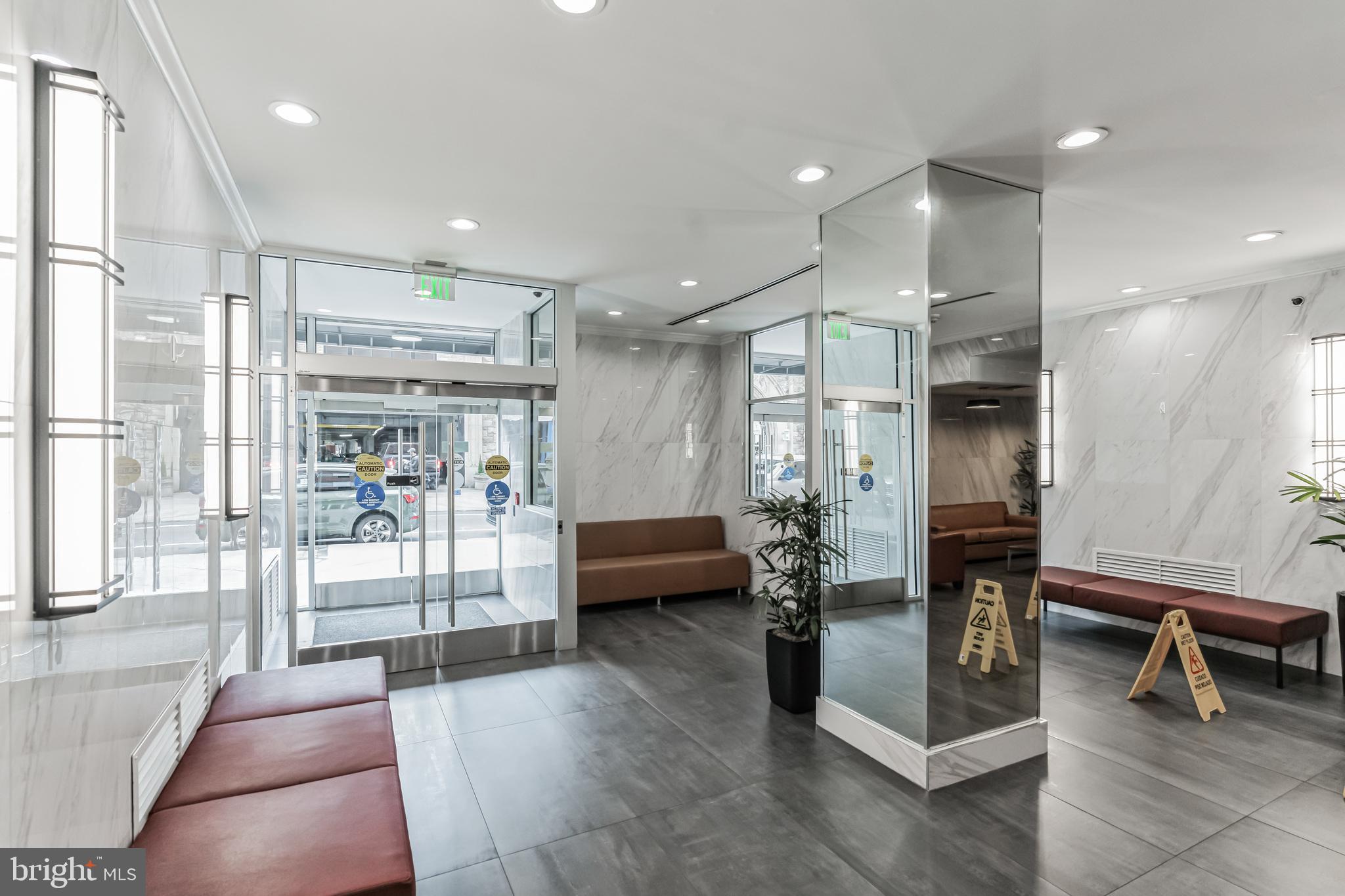 2101 Chestnut Street, Unit 1102 Philadelphia, PA 19103 - Photo 16 of 17 a lobby with furniture and a glass door shower