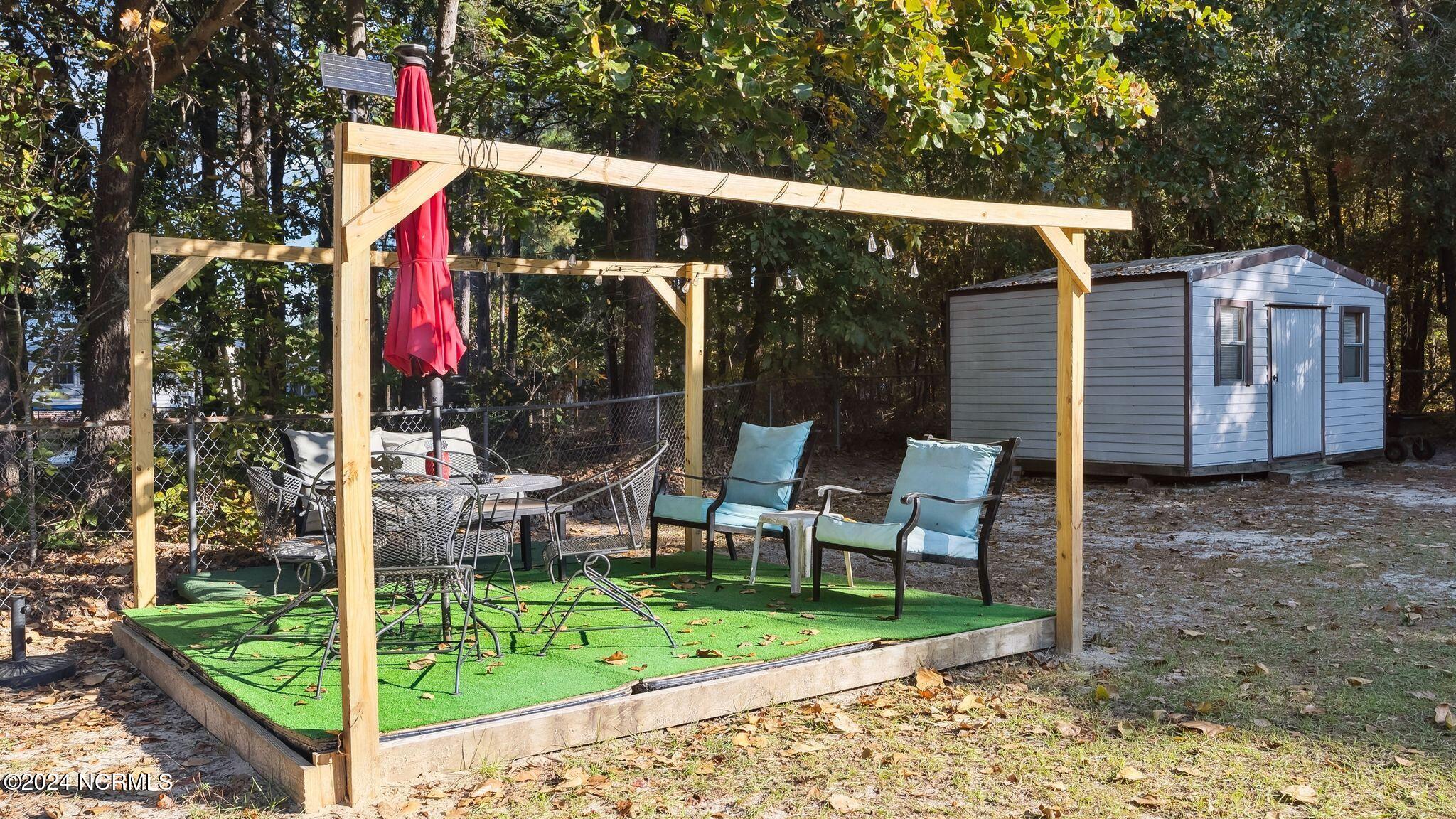 704 Micro Tower Road Lillington, NC 27546 - Photo 27 of 28 Backyard Seating Area