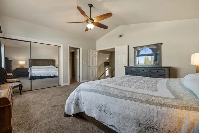 a bathroom with a tub double vanity sink and a mirror