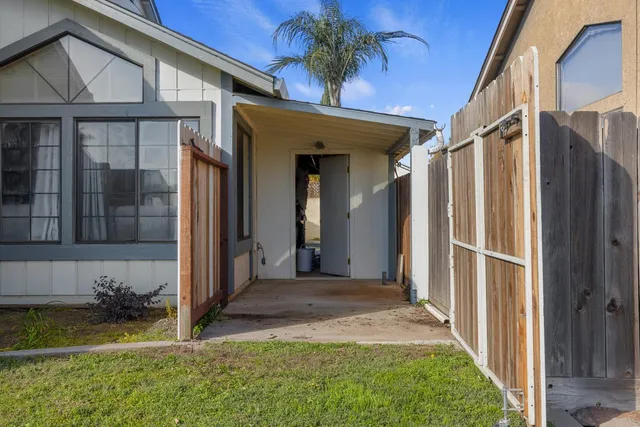 a view of a house with a wooden stairs