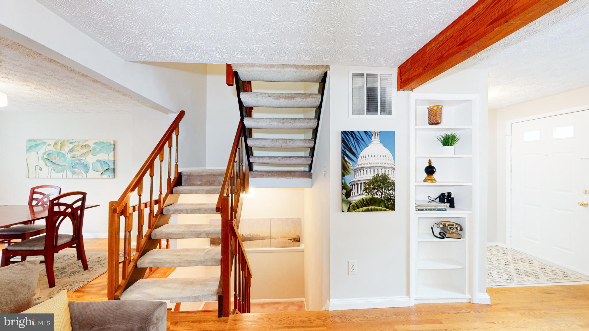 11507 Ivy Bush Court Reston, VA 20191 - Photo 6 of 32 Airy stairwell with wood trim