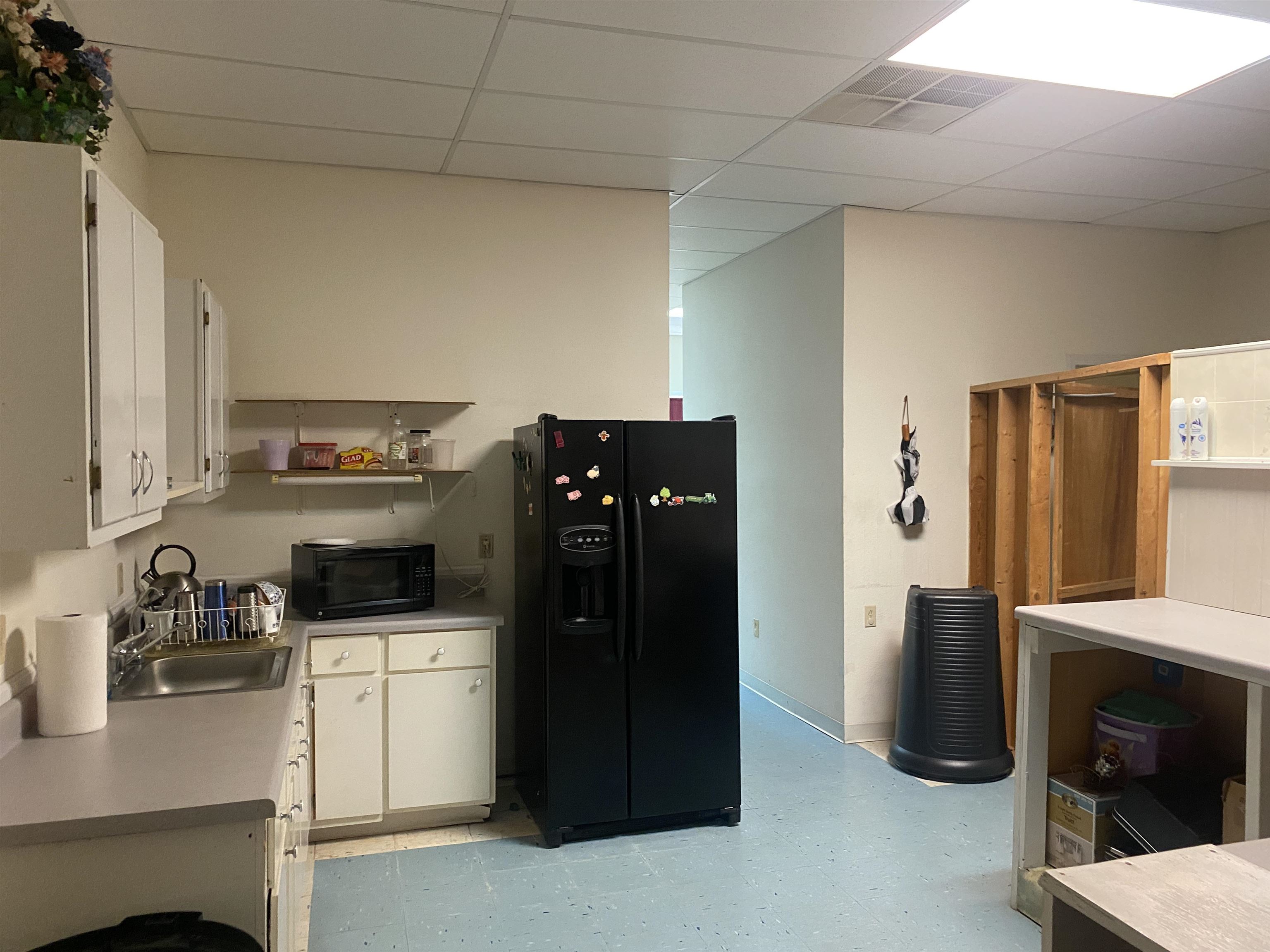 795 Center Point Road North Reagan, TN 38368 - Photo 14 of 40 a kitchen with a refrigerator and cabinets