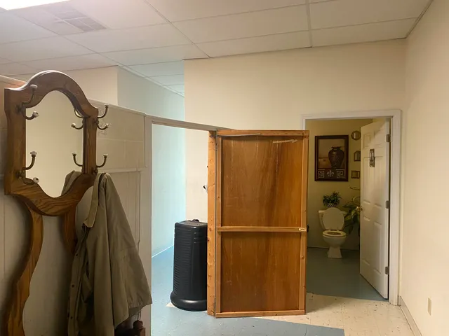 a view of a studio with wooden floor