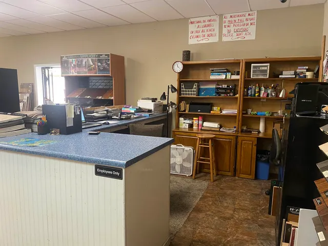 a kitchen with a stove and a refrigerator