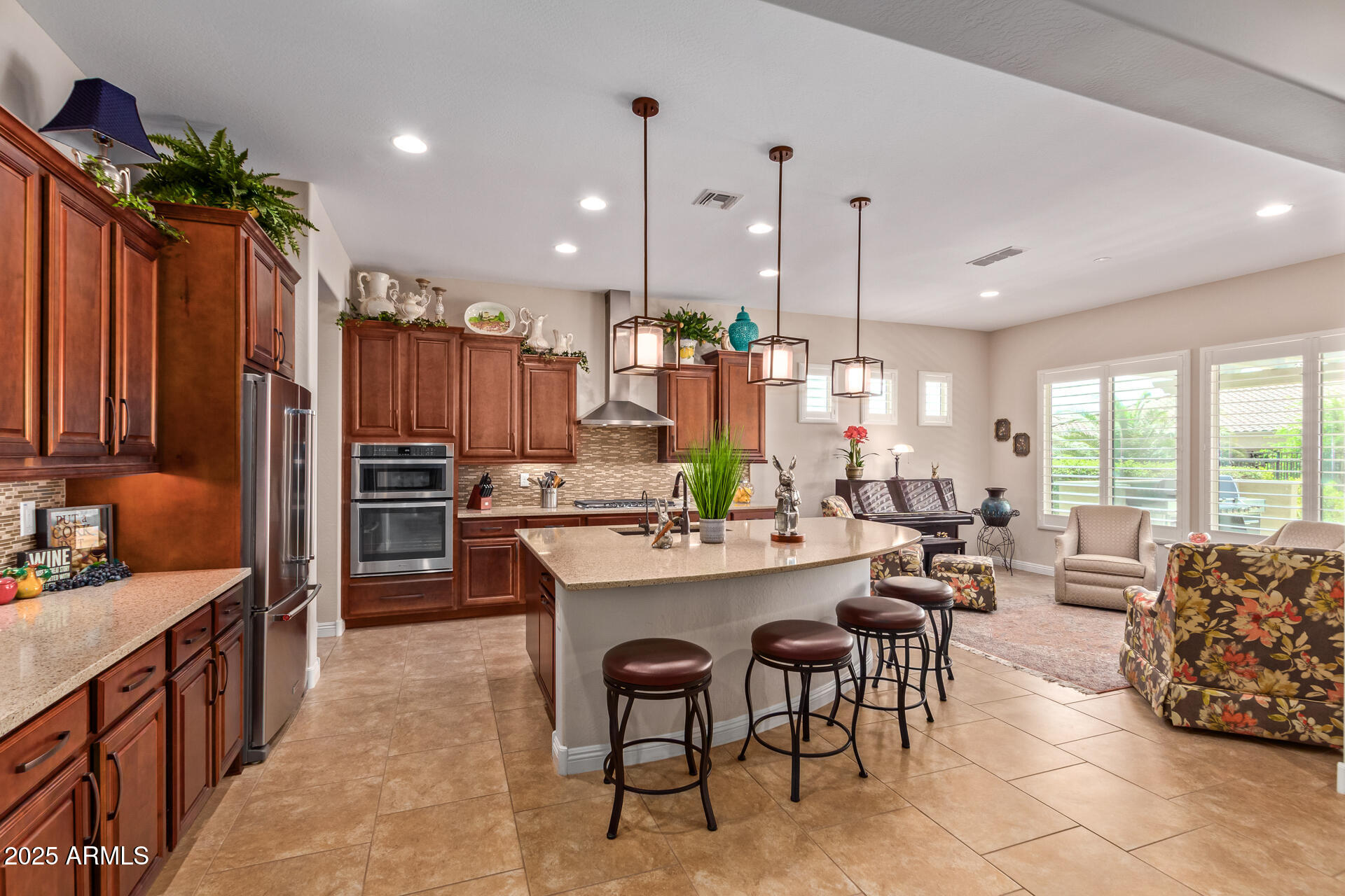 4190 North Imperial Court Florence, AZ 85132 - Photo 26 of 93 a large kitchen with a table and chairs