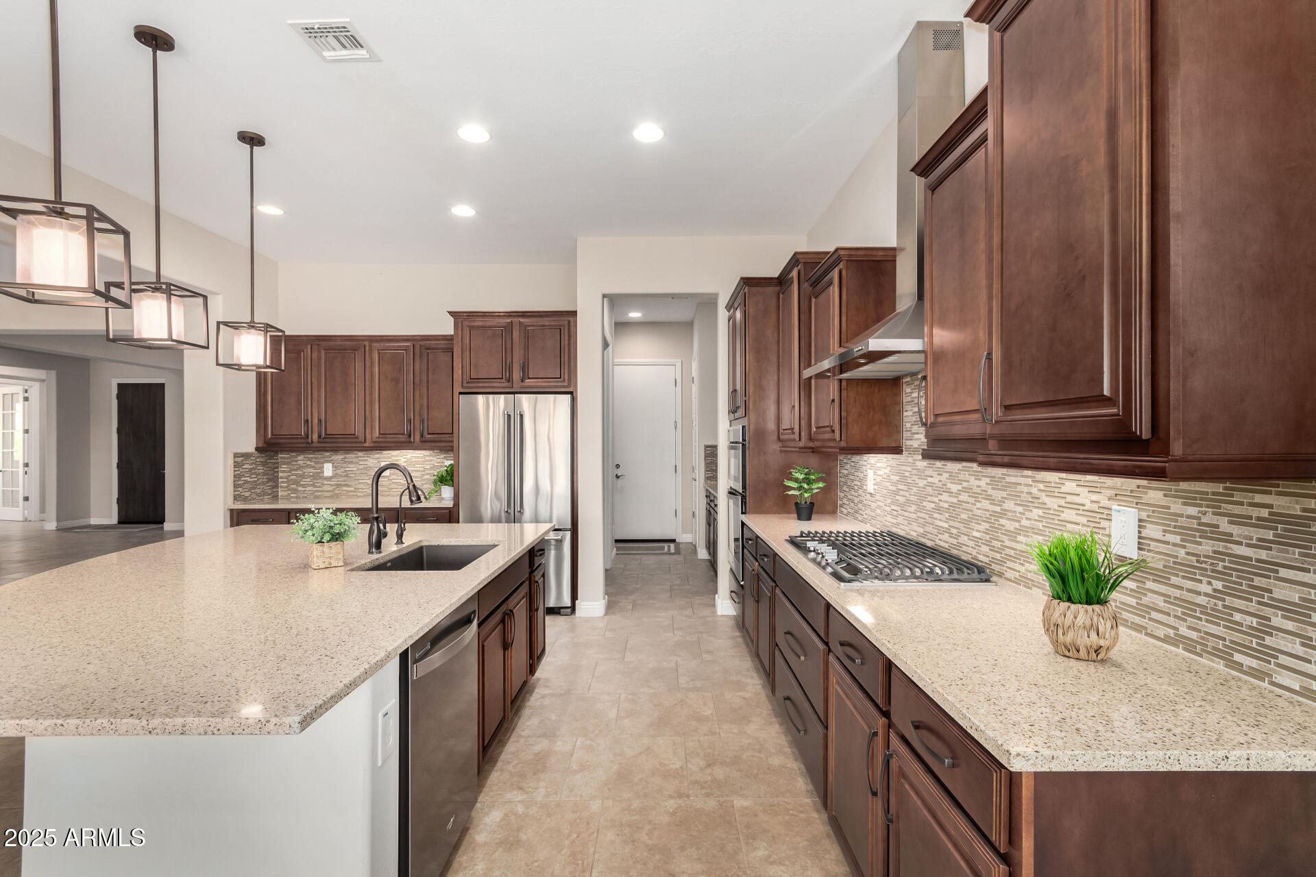 4190 North Imperial Court Florence, AZ 85132 - Photo 29 of 93 a kitchen with stainless steel appliances granite countertop sink stove and refrigerator