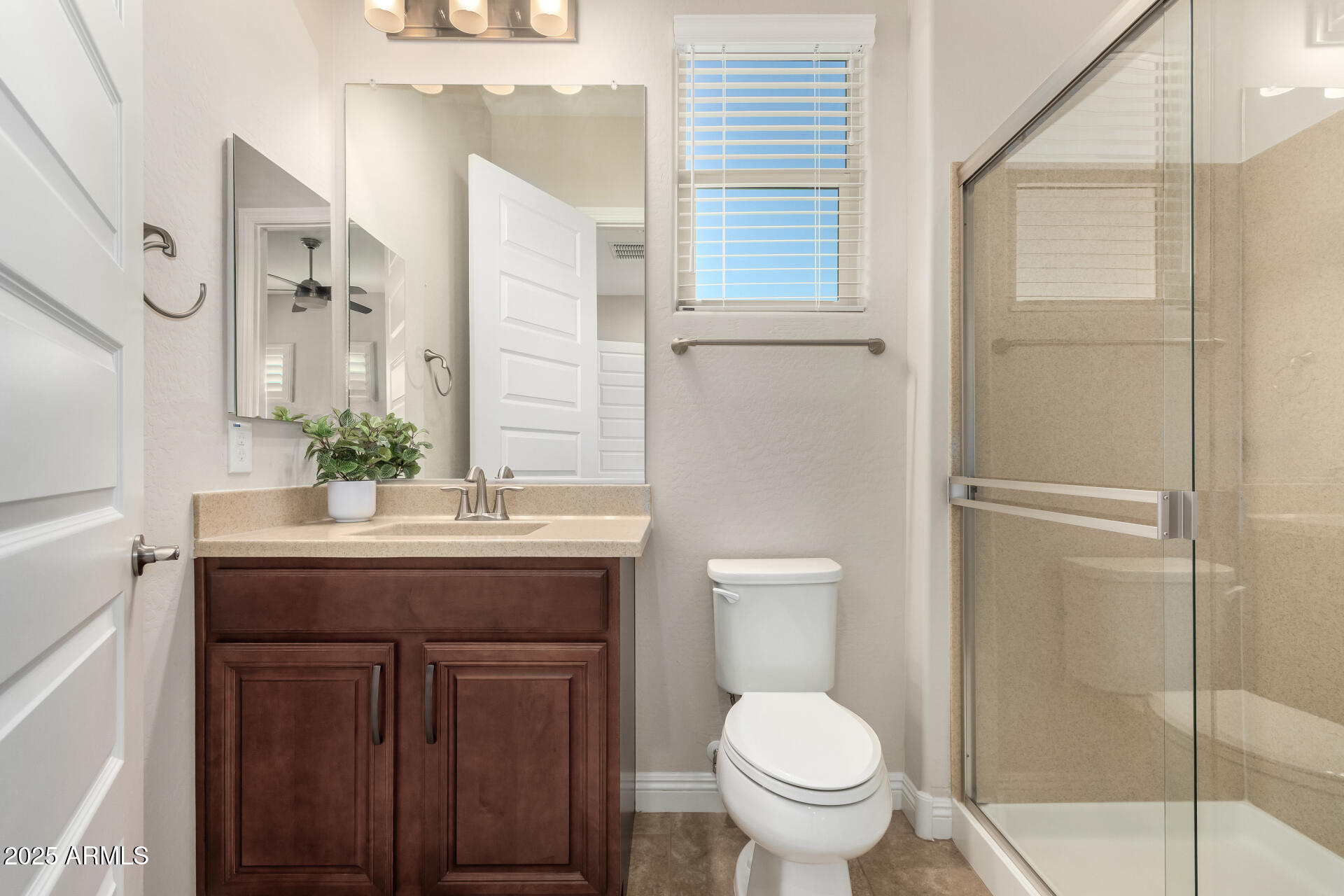 4190 North Imperial Court Florence, AZ 85132 - Photo 52 of 93 a bathroom with a granite countertop toilet a sink and a mirror