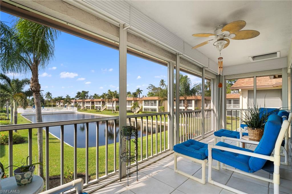 a view of a balcony with furniture