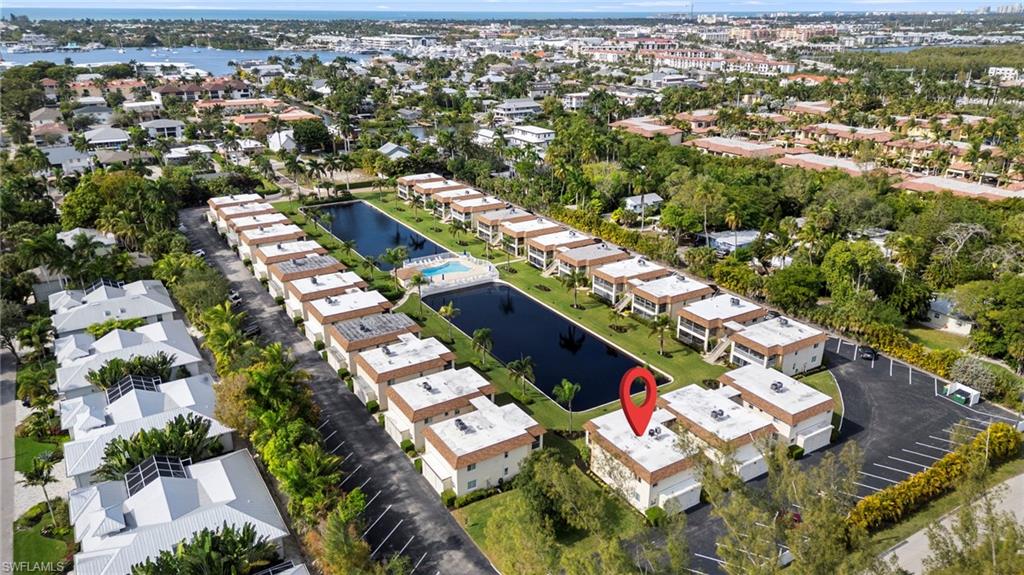1155 Sandpiper Street, Unit G2 Naples, FL 34102 - Photo 8 of 8 an aerial view of residential houses with outdoor space