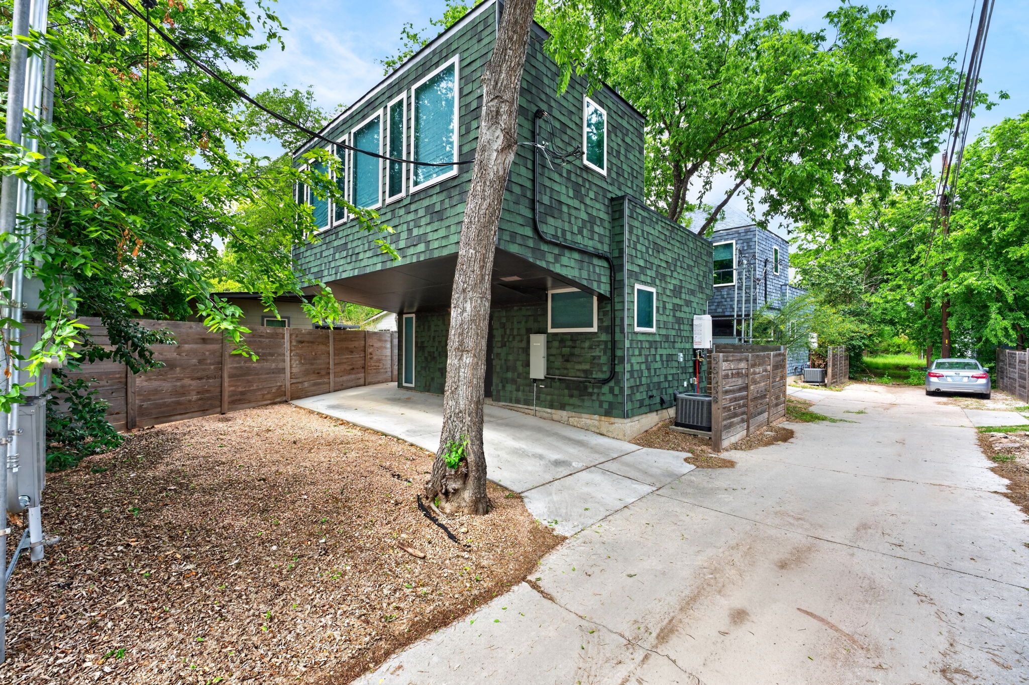 5505 Duval Street, Unit B Austin, TX 78751 - Photo 2 of 32 a view of a house with table and chairs in a yard