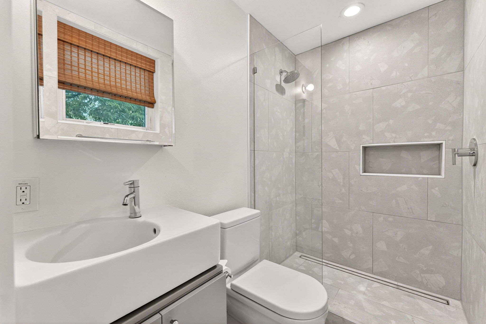 5505 Duval Street, Unit B Austin, TX 78751 - Photo 21 of 32 a bathroom with a sink a toilet and shower