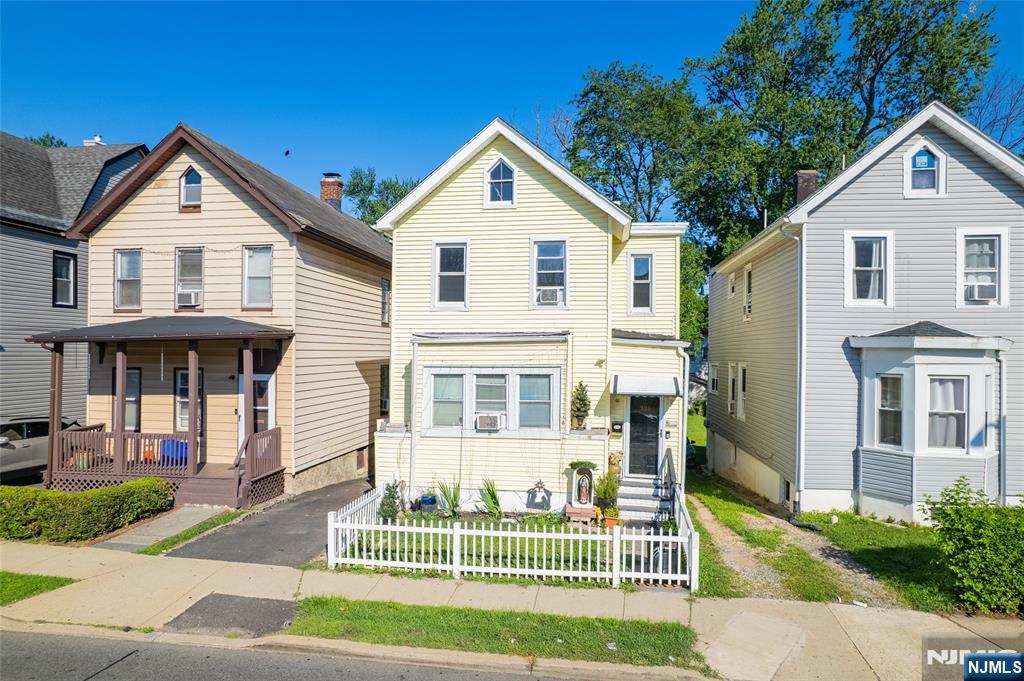 321 Grove Street Bloomfield, NJ 07017 - Photo 1 of 22 a front view of a house with a yard