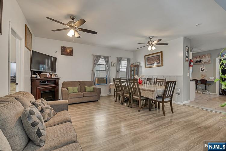321 Grove Street Bloomfield, NJ 07017 - Photo 4 of 22 a living room with furniture and a wooden floor