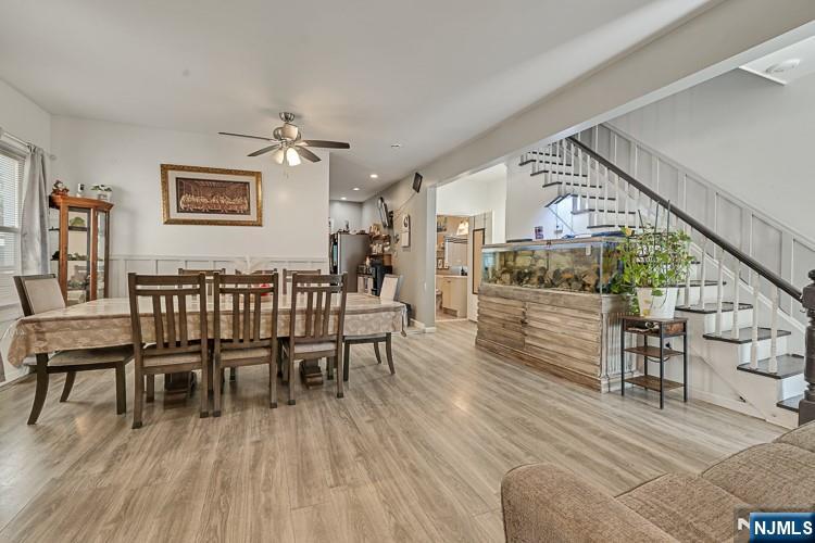 321 Grove Street Bloomfield, NJ 07017 - Photo 7 of 22 a dining room with furniture entryway and wooden floor