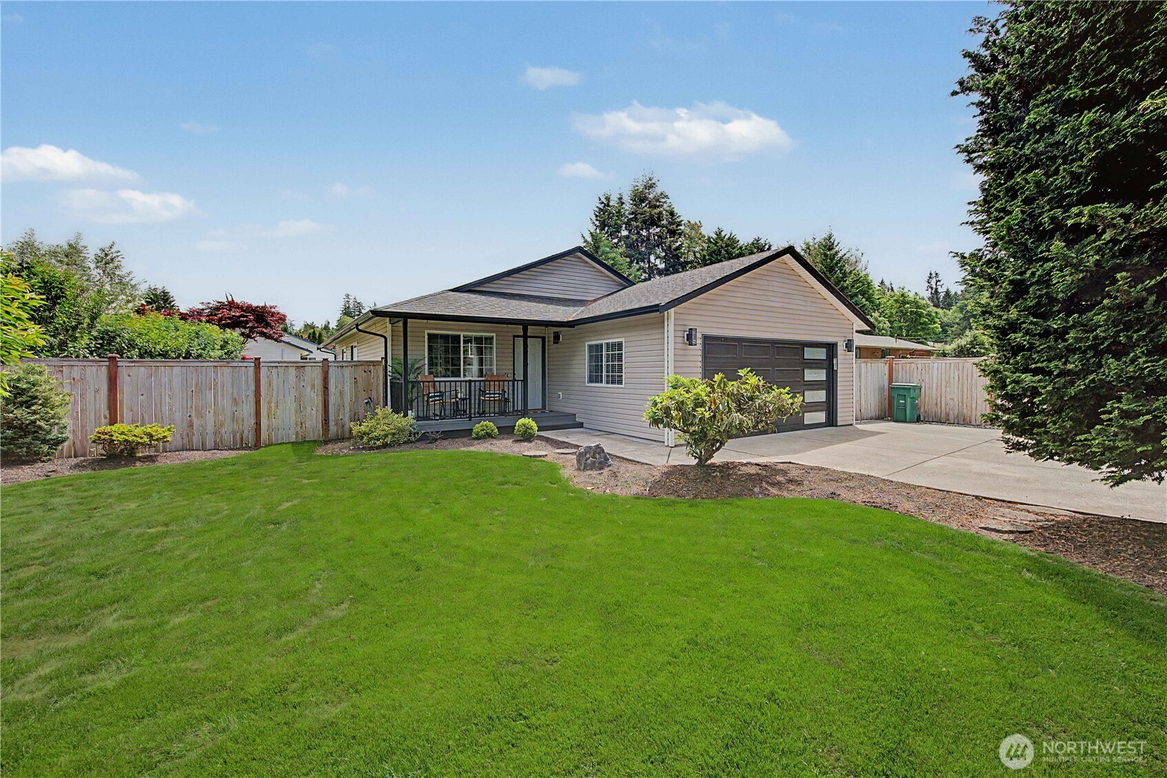 20919 Ronning Road Arlington, WA 98223 - Photo 1 of 28 a front view of a house with a yard and green space
