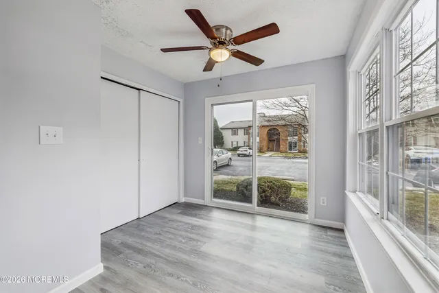 a view of livingroom with a ceiling fan and window