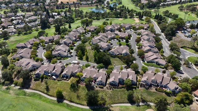 a view of a balcony with two chairs and a table