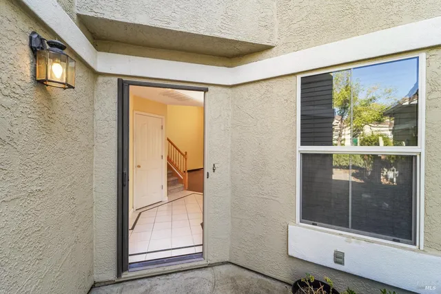 a view of a kitchen with a sink and dishwasher a kitchen island with wooden floor