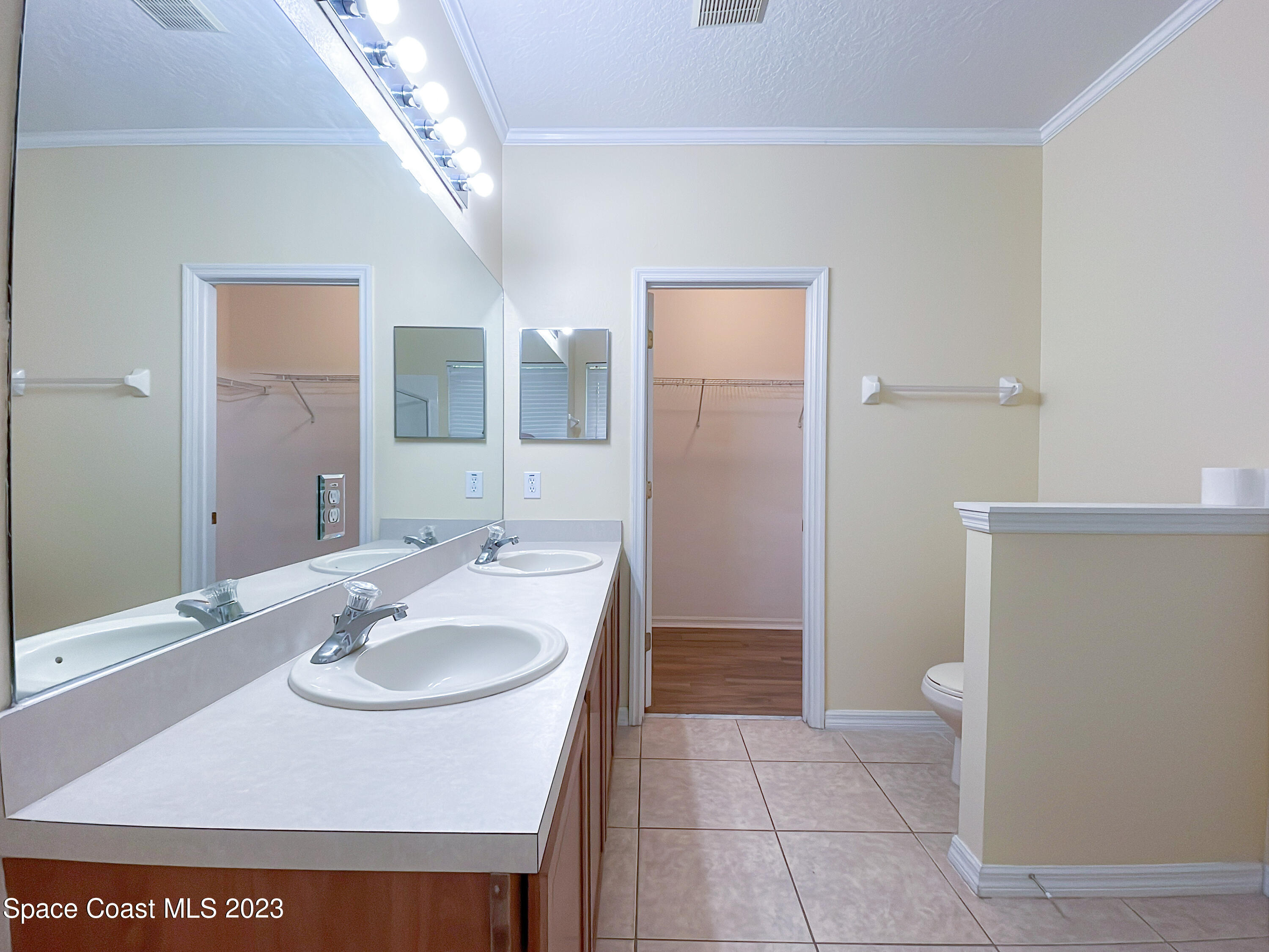 978 Riviera Point Drive Rockledge, FL 32955 - Photo 16 of 29 Master Bathroom to walk in closet