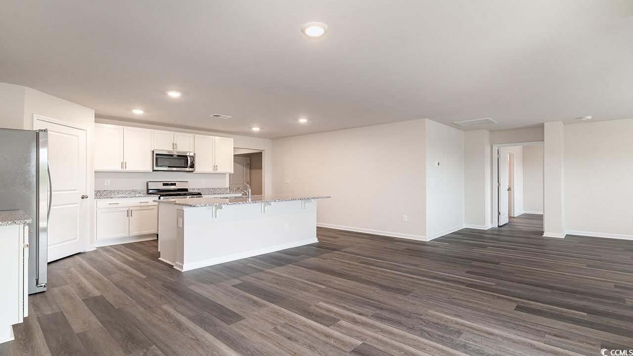6068 Fuller Rdg Court Conway, SC 29526 - Photo 5 of 22 Unfurnished living room featuring dark wood-type f