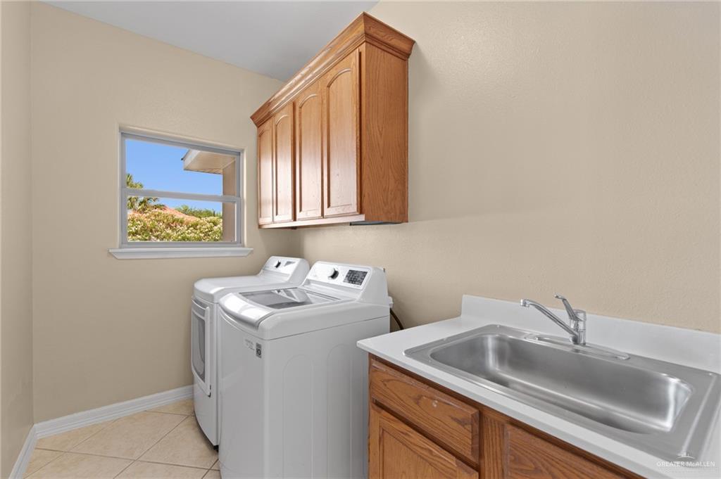 112 Madelyn Rose Bayview, TX 78566 - Photo 13 of 41 a bathroom with a sink and cabinets