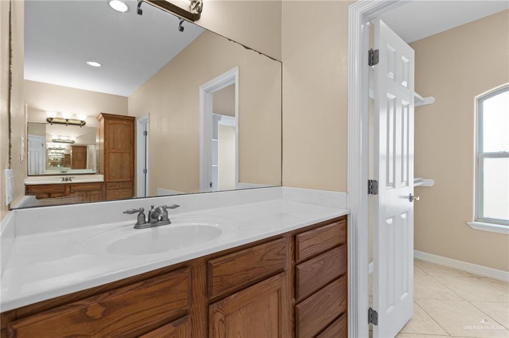 112 Madelyn Rose Bayview, TX 78566 - Photo 20 of 41 a bathroom with a sink double vanity and a mirror