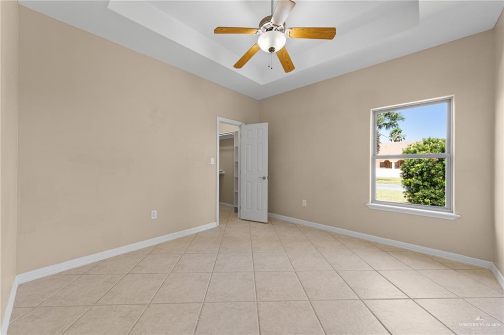 112 Madelyn Rose Bayview, TX 78566 - Photo 24 of 41 wooden floor in an empty room with a window
