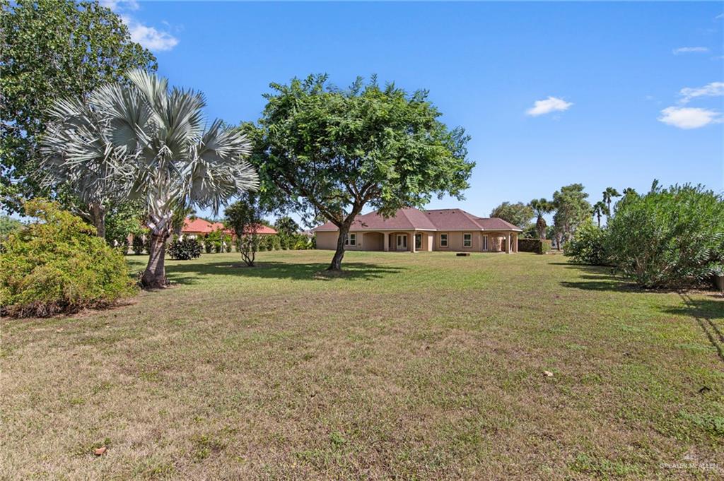 112 Madelyn Rose Bayview, TX 78566 - Photo 30 of 41 a view of a house with yard and green space