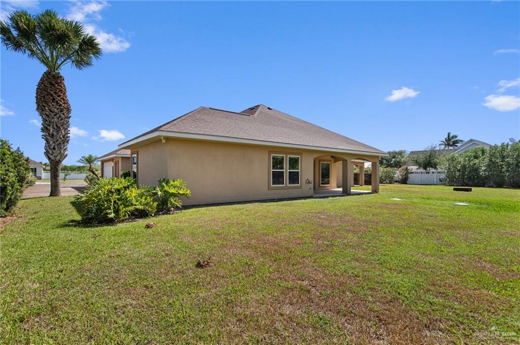 112 Madelyn Rose Bayview, TX 78566 - Photo 32 of 41 a front view of a house with garden