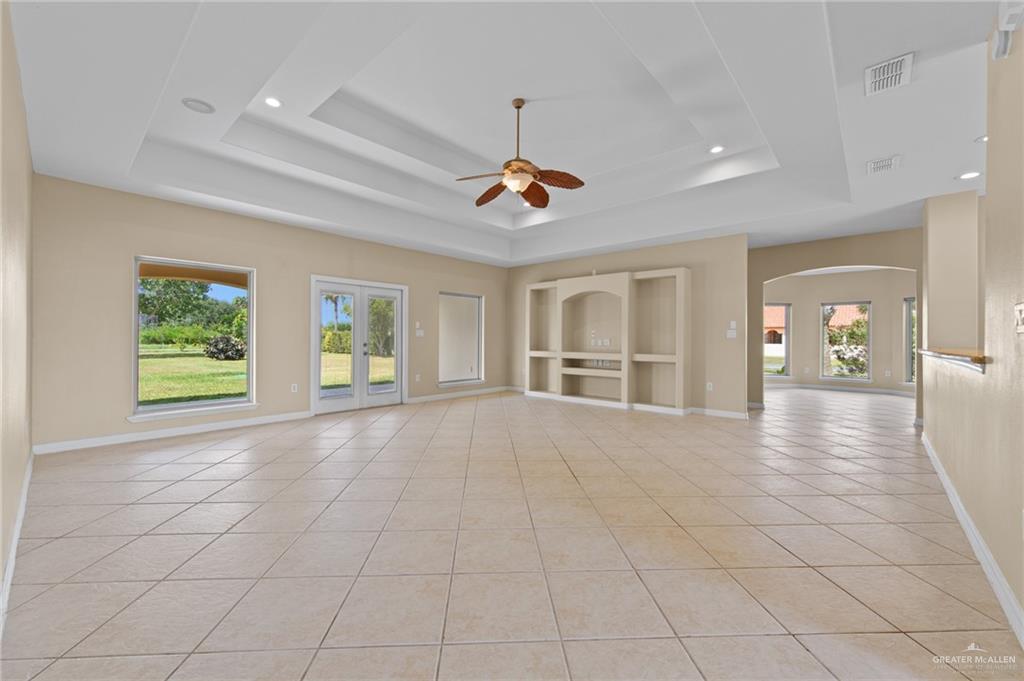 112 Madelyn Rose Bayview, TX 78566 - Photo 4 of 41 a view of empty room with wooden floor and fan