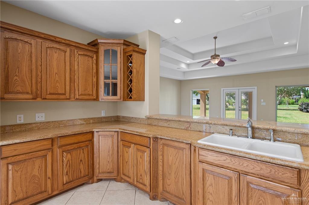 112 Madelyn Rose Bayview, TX 78566 - Photo 8 of 41 a kitchen with cabinets appliances a sink and a window