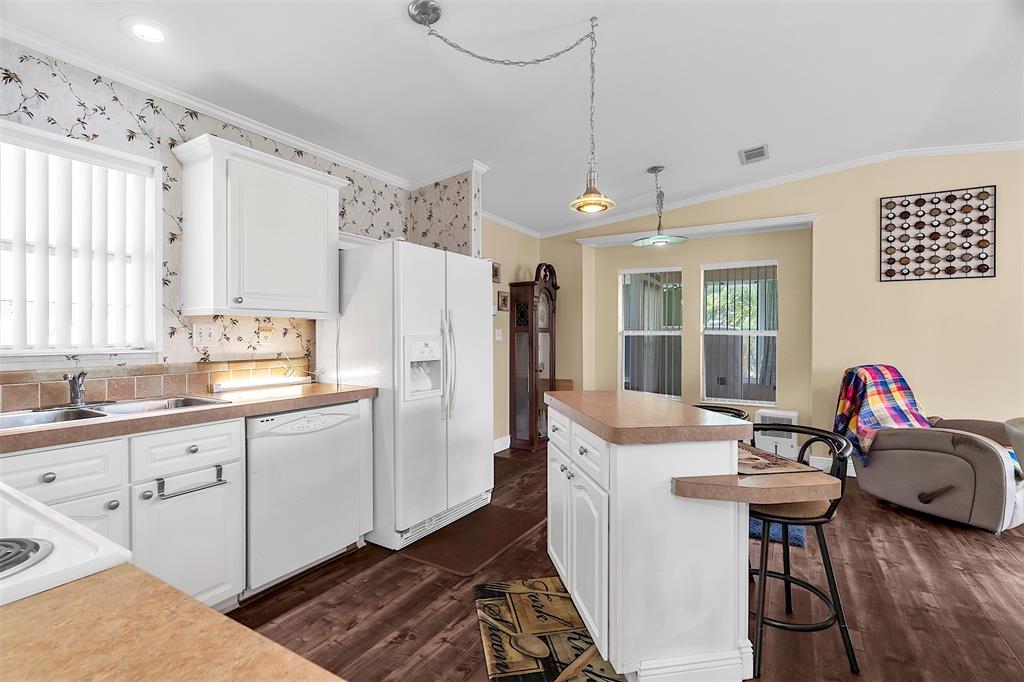809 Putter Place Pompano Beach, FL 33069 - Photo 13 of 51 a kitchen with granite countertop a sink appliances cabinets and furniture