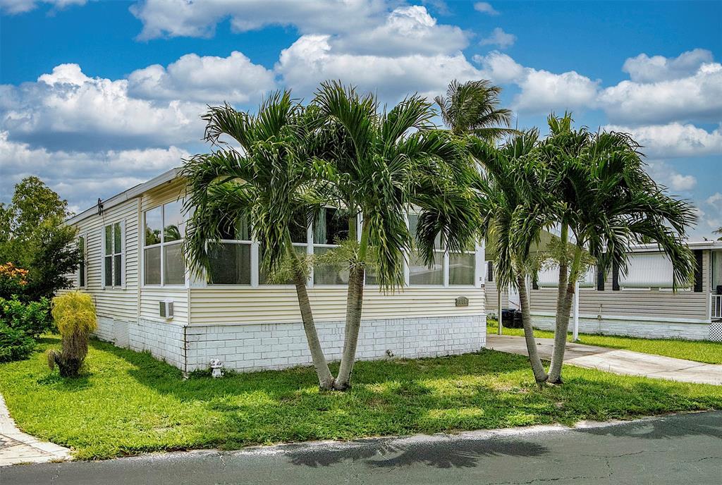 809 Putter Place Pompano Beach, FL 33069 - Photo 2 of 51 a view of a house with a yard