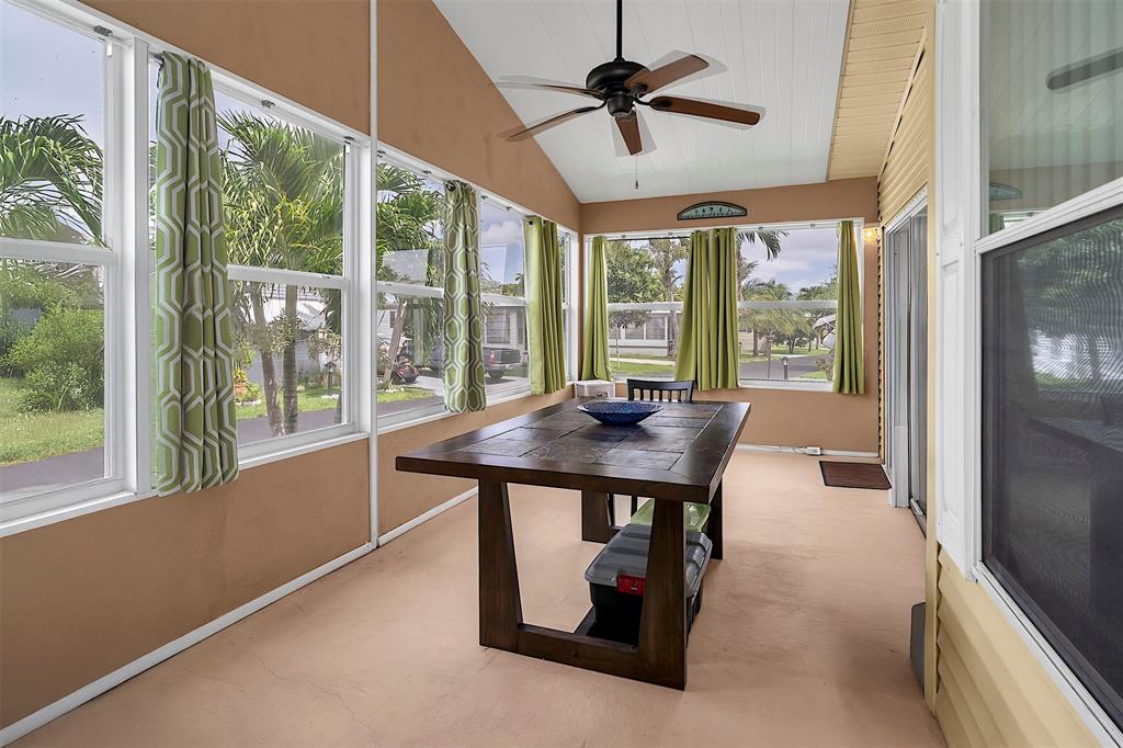 809 Putter Place Pompano Beach, FL 33069 - Photo 24 of 51 a view of a livingroom with furniture window and outside view