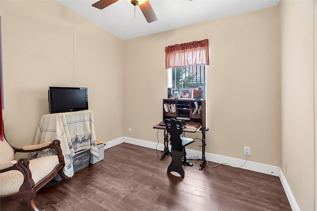 809 Putter Place Pompano Beach, FL 33069 - Photo 25 of 51 a view of a workspace with furniture and a window