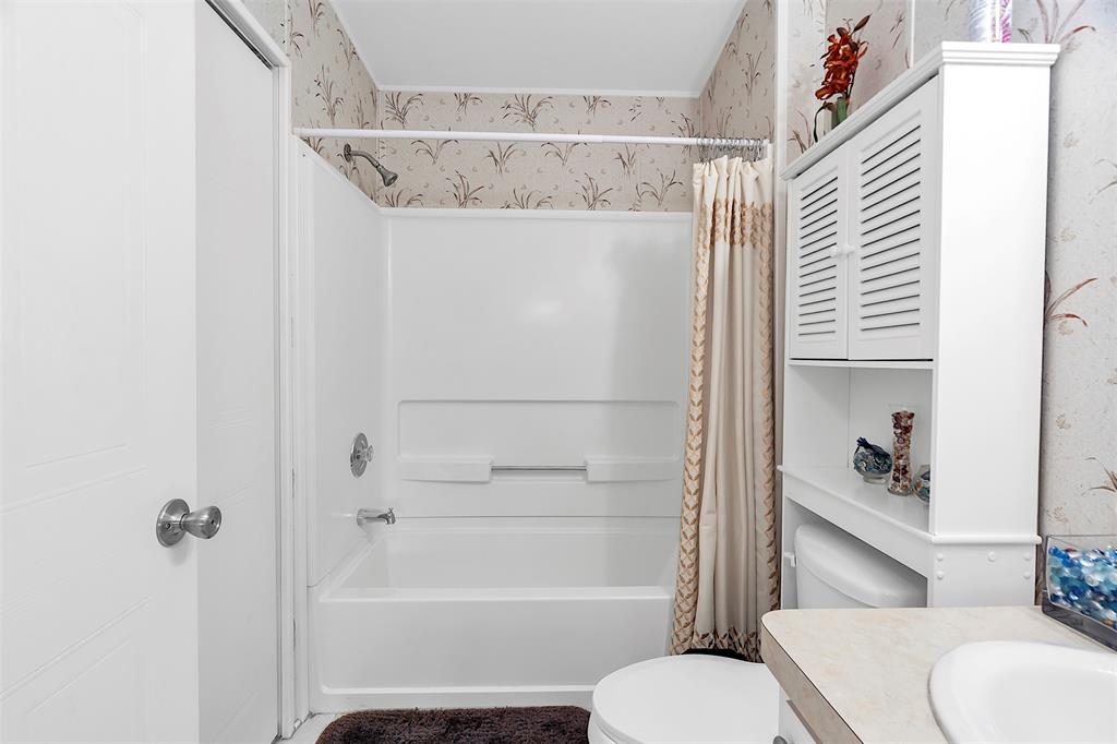 809 Putter Place Pompano Beach, FL 33069 - Photo 29 of 51 a bathroom with a sink and toilet