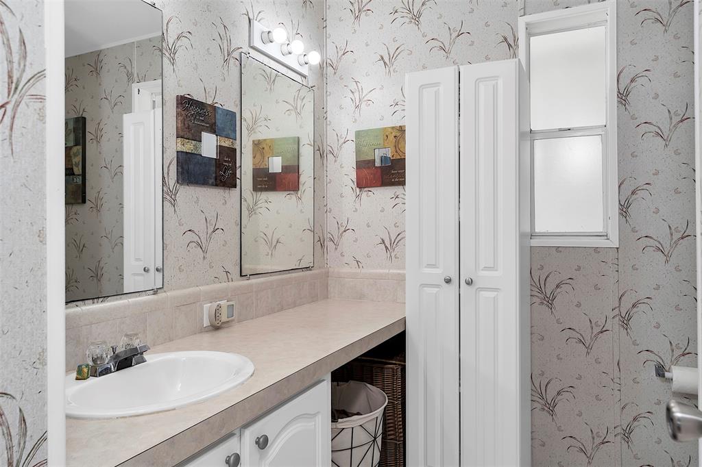 809 Putter Place Pompano Beach, FL 33069 - Photo 36 of 51 a bathroom with a sink vanity granite shower and a mirror