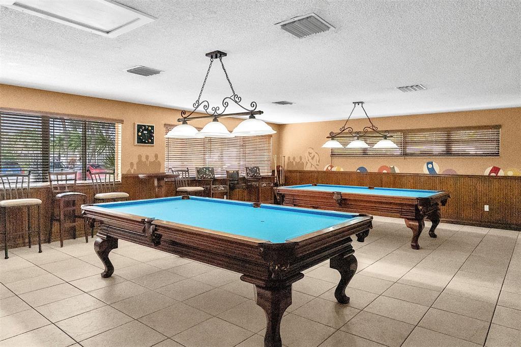 809 Putter Place Pompano Beach, FL 33069 - Photo 40 of 51 a room with pool tables and windows