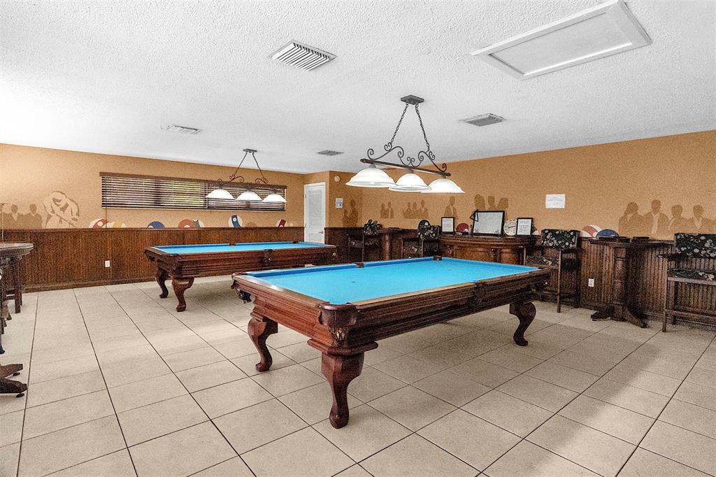 809 Putter Place Pompano Beach, FL 33069 - Photo 41 of 51 a room with pool table and windows