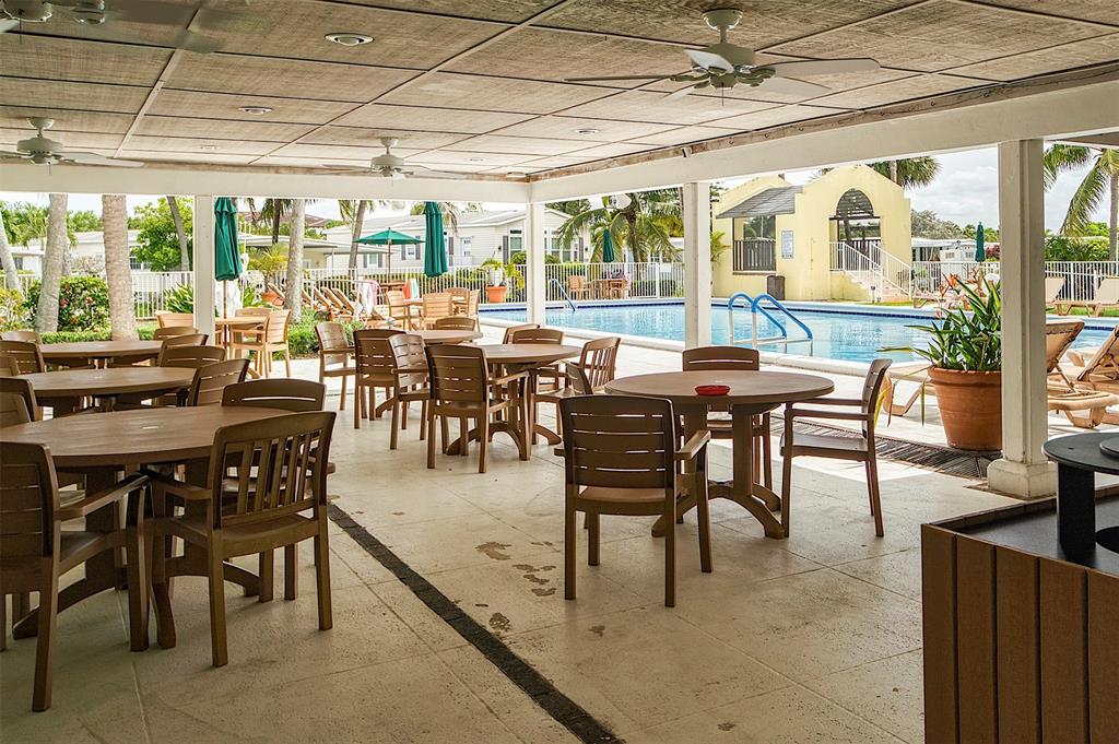 809 Putter Place Pompano Beach, FL 33069 - Photo 46 of 51 a view of a dining room with furniture window and outside view