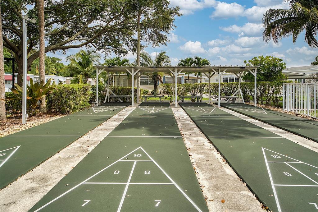 809 Putter Place Pompano Beach, FL 33069 - Photo 51 of 51 a view of yard with large trees