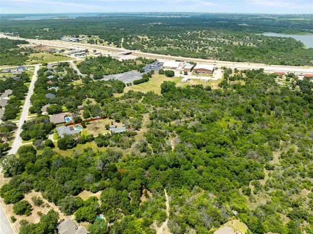a view of a field with an ocean view