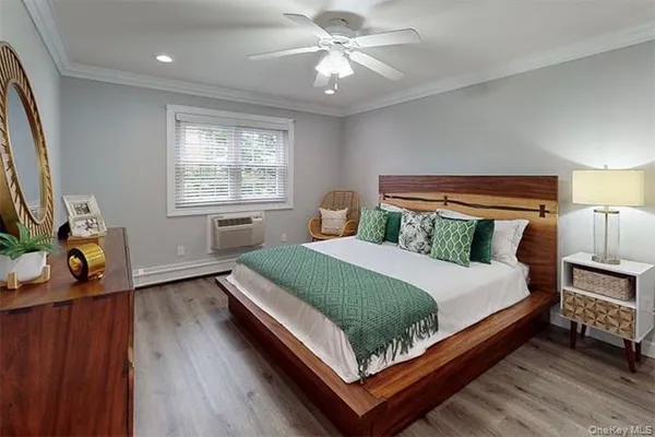 a bedroom with a bed window and a table