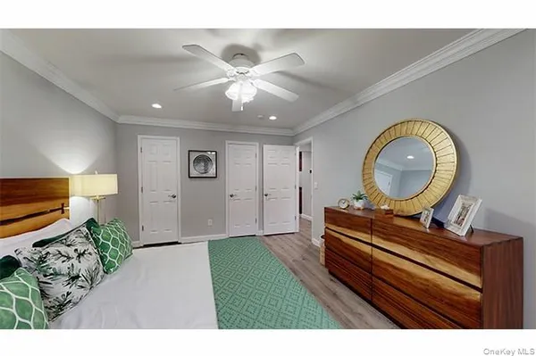 a living room with furniture and a mirror