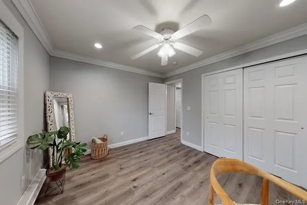 a view of an empty room and wooden floor