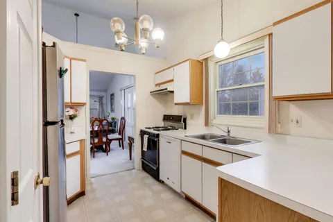 a kitchen that has a lot of cabinets in it