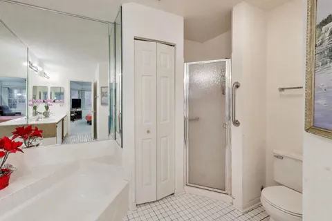 a view of a bathroom with a bathtub and toilet