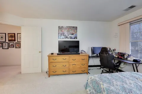 a room with furniture and a flat screen tv