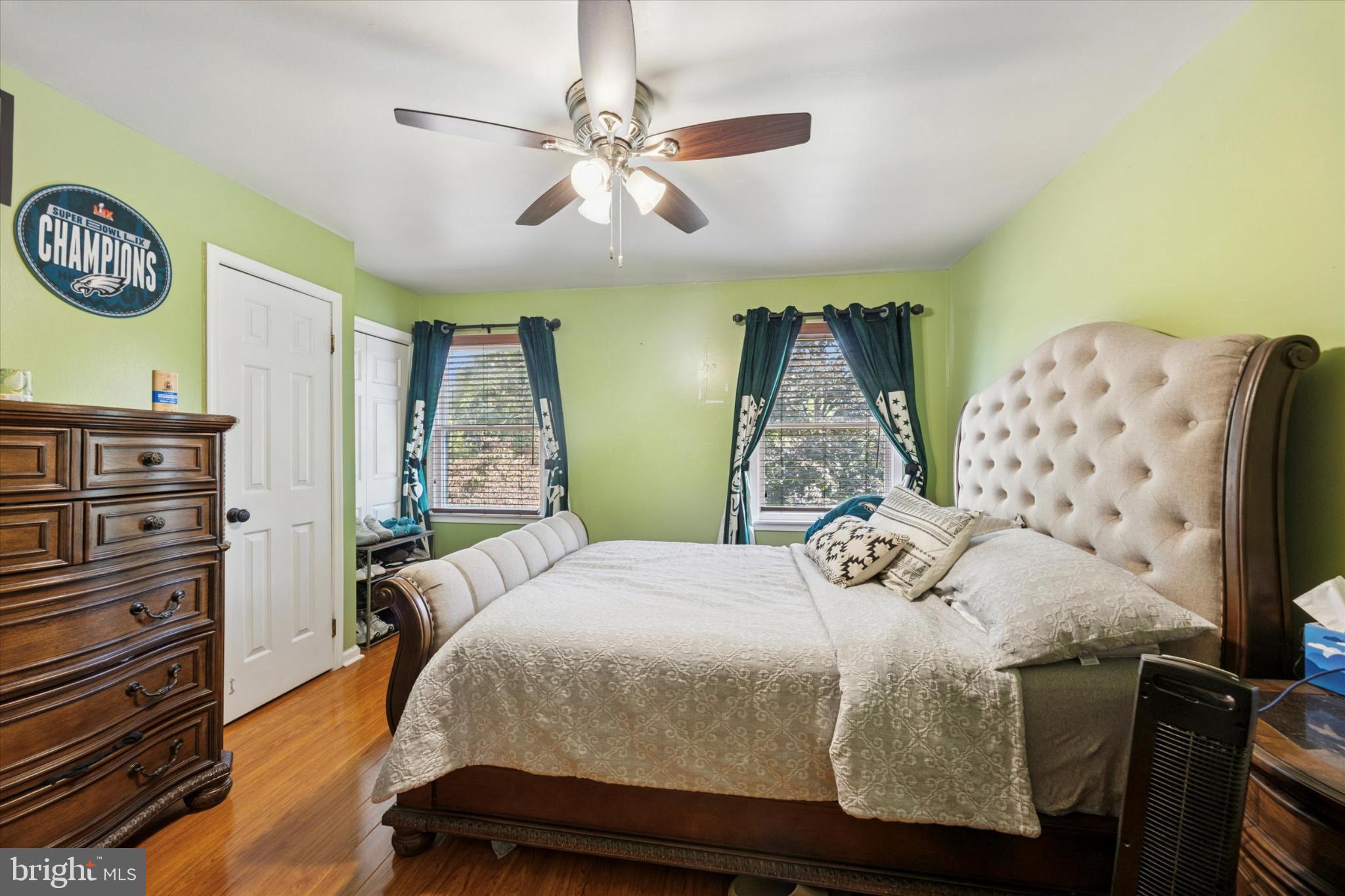 506 Flora Circle Springfield, PA 19064 - Photo 22 of 35 a bedroom with a bed and ceiling fan